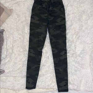 Distressed camo jeans